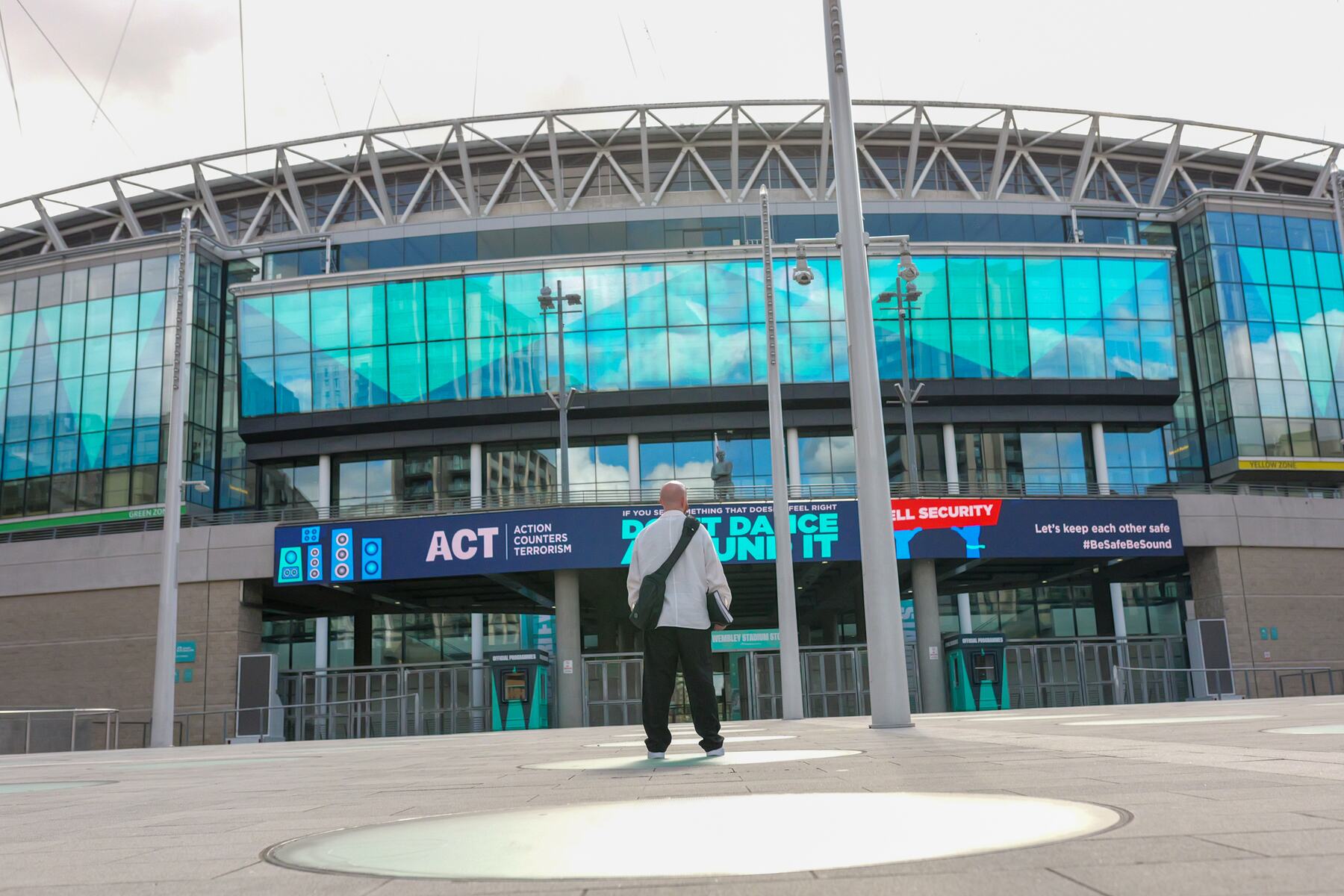 Luke Staton standing alone outside Wembley Stadium.