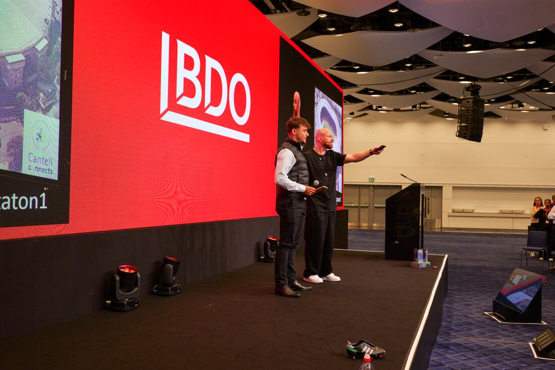 Luke Staton on stage in front of the BDO screen at Wembley Stadium.